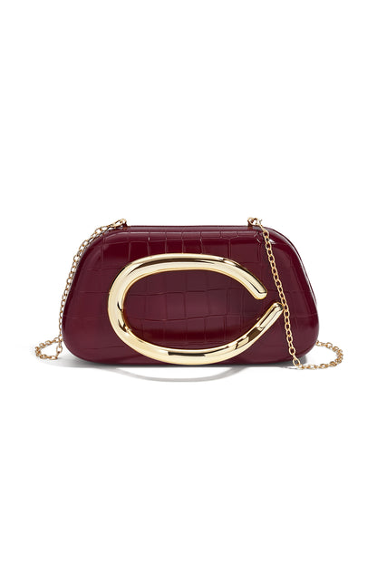 Borsa principessa con accento dorato a C