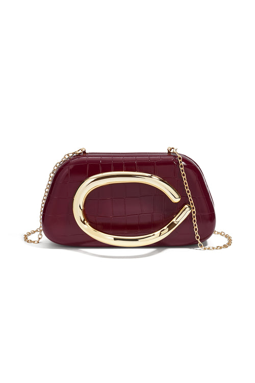 Borsa principessa con accento dorato a C
